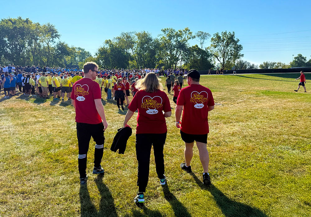 Team members walking together outdoors